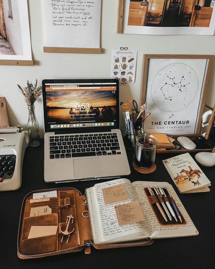 Study desk with laptop, notes, and research materials